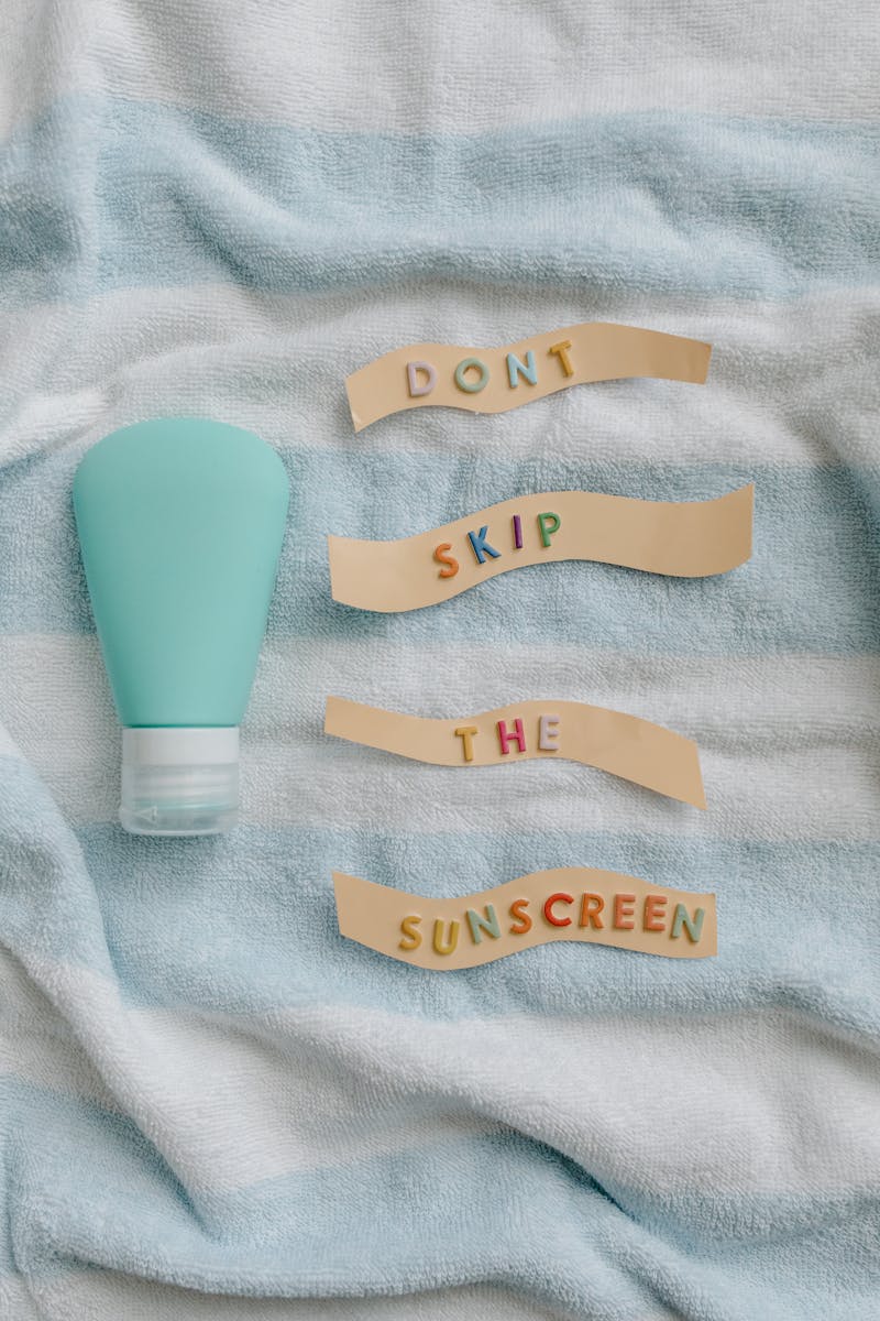 Promote skin health with a reminder to apply sunscreen daily from a flat lay photo.